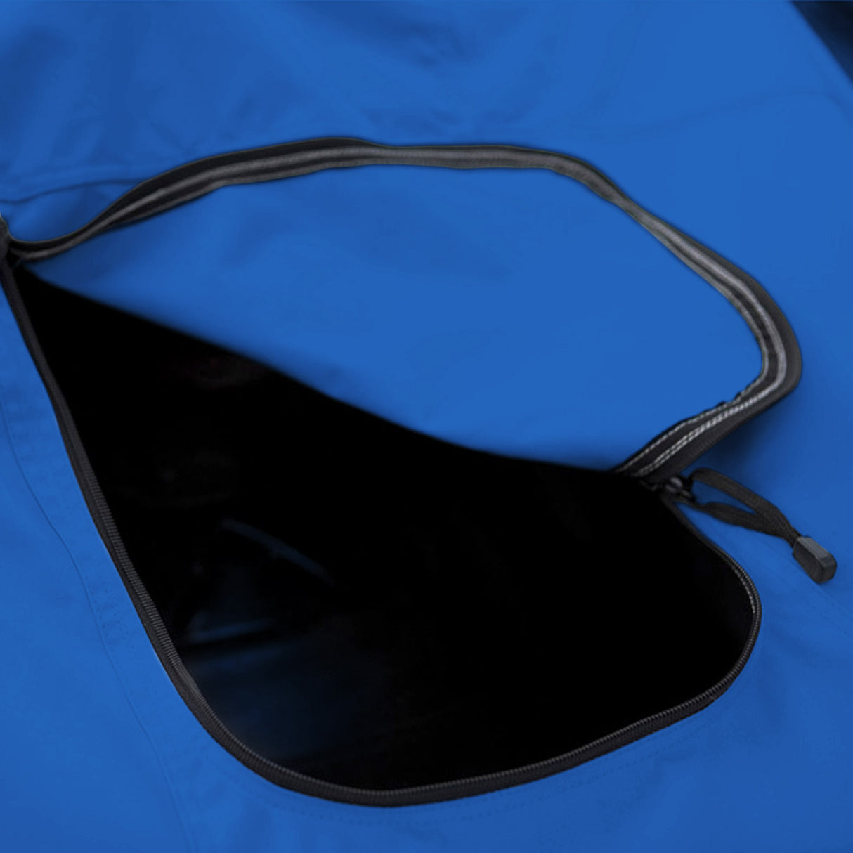 Close-up of blue zippered gas tank access built into a snowmobile cover, allowing easy and convenient refueling while the cover remains installed.