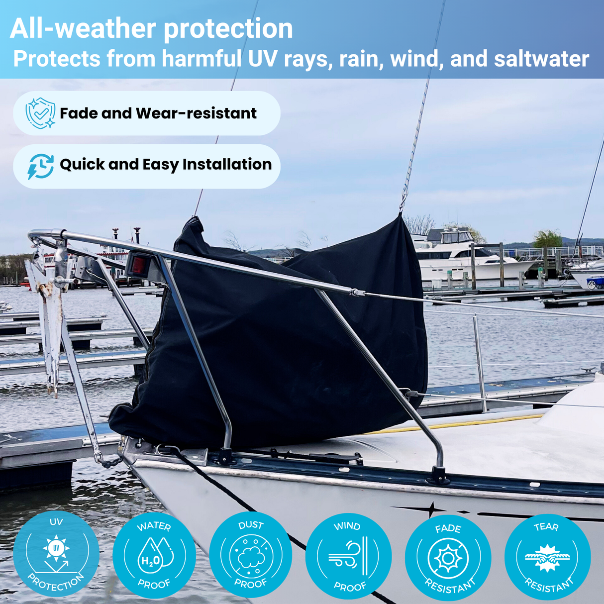 sailboat docked at marina with black marine-grade canvas jib sail bag covering furled head sail, surrounded by rigging lines and stainless steel railings, showcasing durable sail protection and recreational sailing setup in harbor conditions