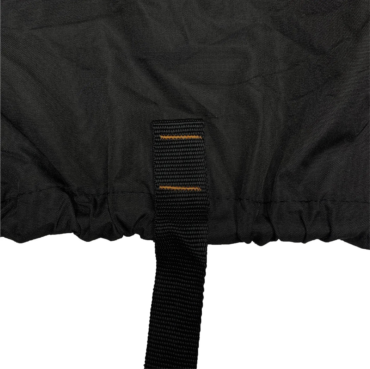 Close-up of strap and elastic hem on a black vehicle cover, designed to secure the cover tightly underneath the vehicle and prevent shifting, flapping, or wind lift during outdoor storage.