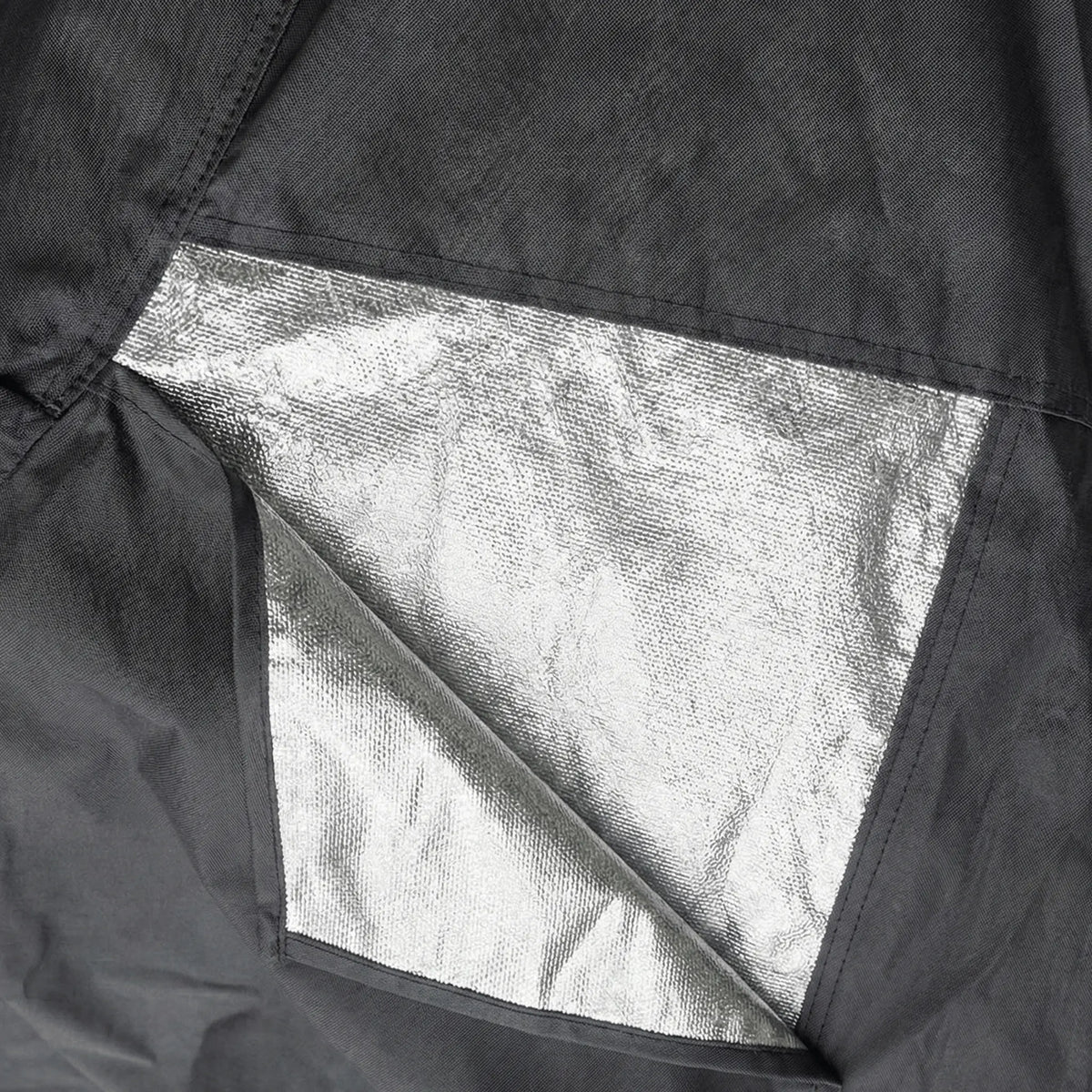 Detailed view of heavy duty, metallic heat shield fabric panels that guard against hot exhaust damage.