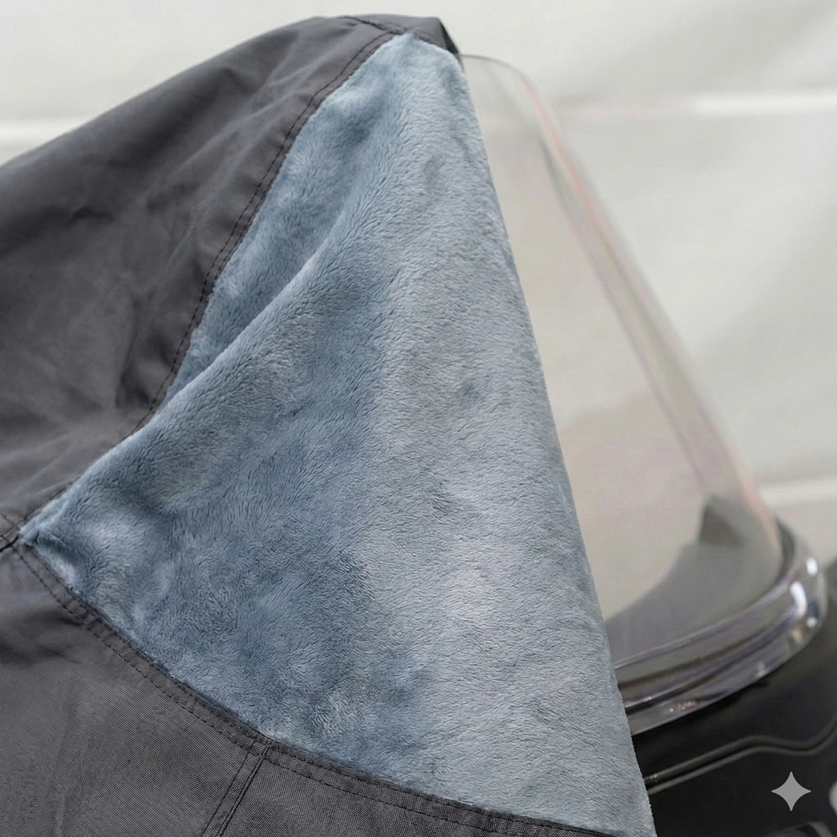 Close-up view of the non-scratch inner fleece lining inside the cover, designed to protect the windshield and painted surfaces from abrasions, scuffs, and wear during storage.