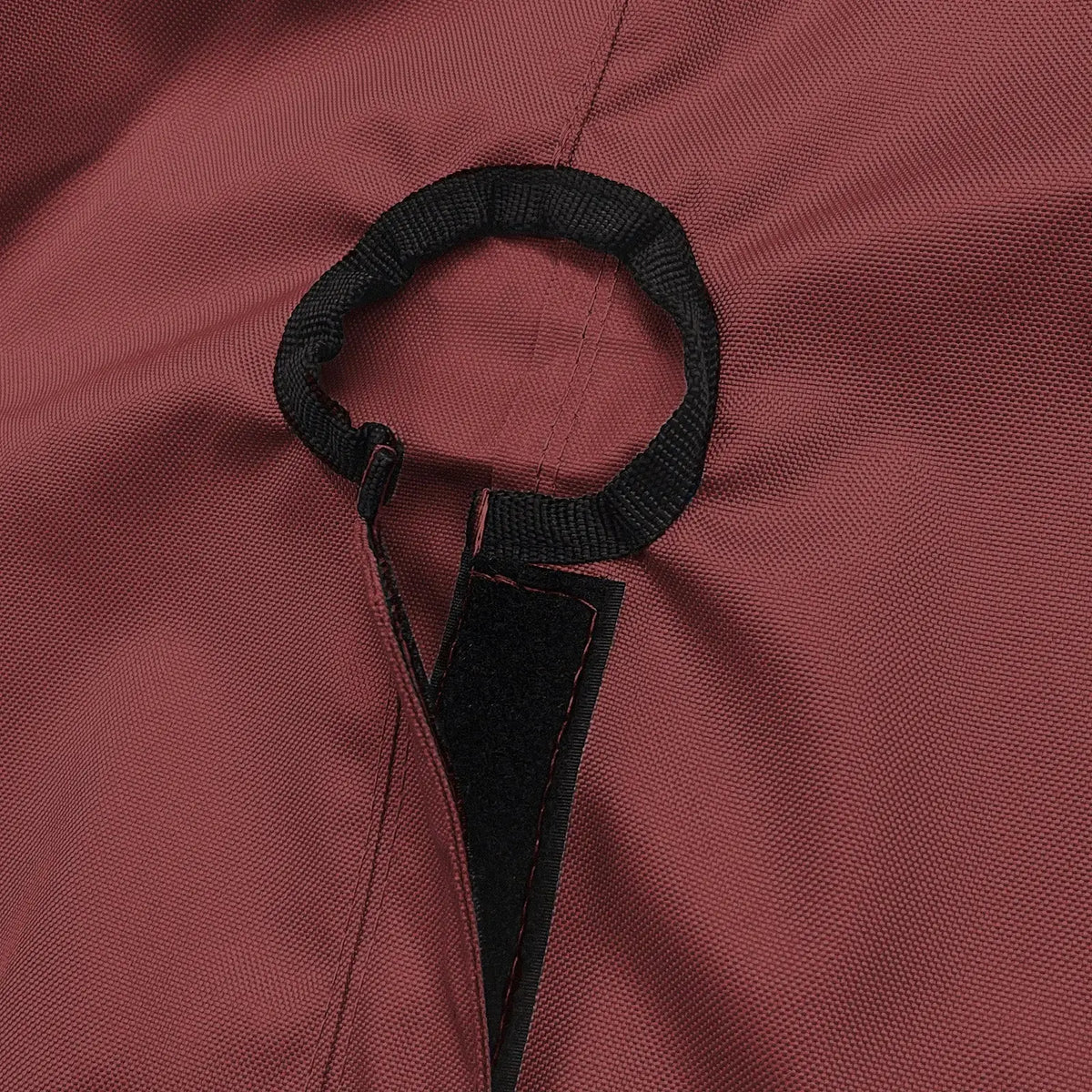 Close-up of SAVVYCRAFT® burgundy waterproof boat steering wheel cover showing elastic opening and reinforced fastening strap for secure marine fit
