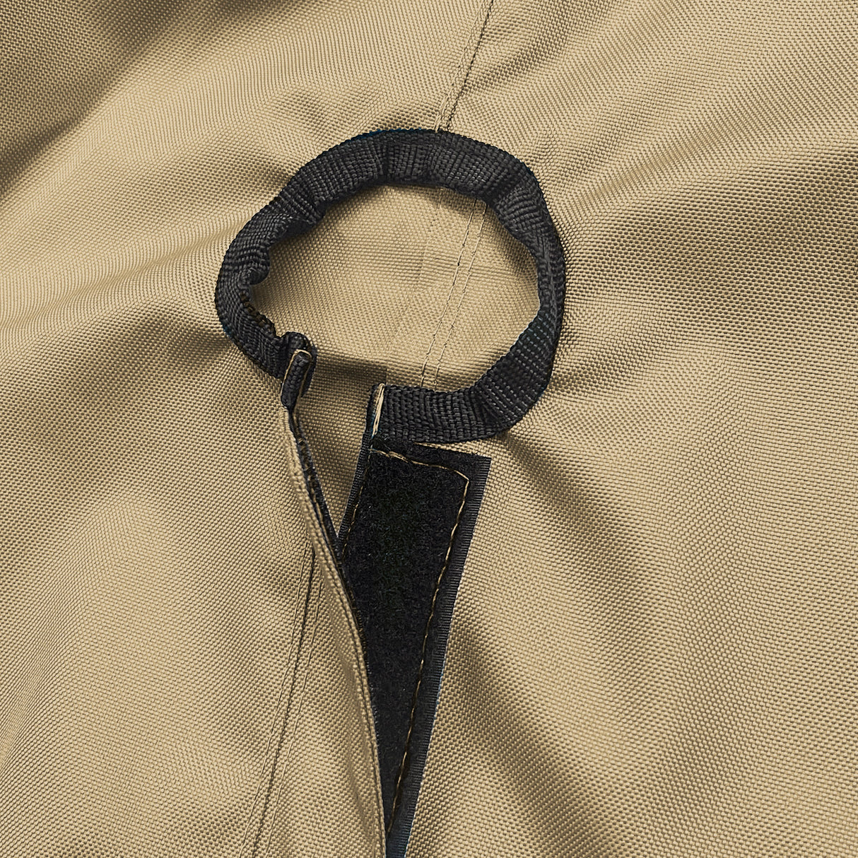 Close-up of SAVVYCRAFT® tan waterproof boat steering wheel cover showing elastic opening and reinforced fastening strap for secure marine fit