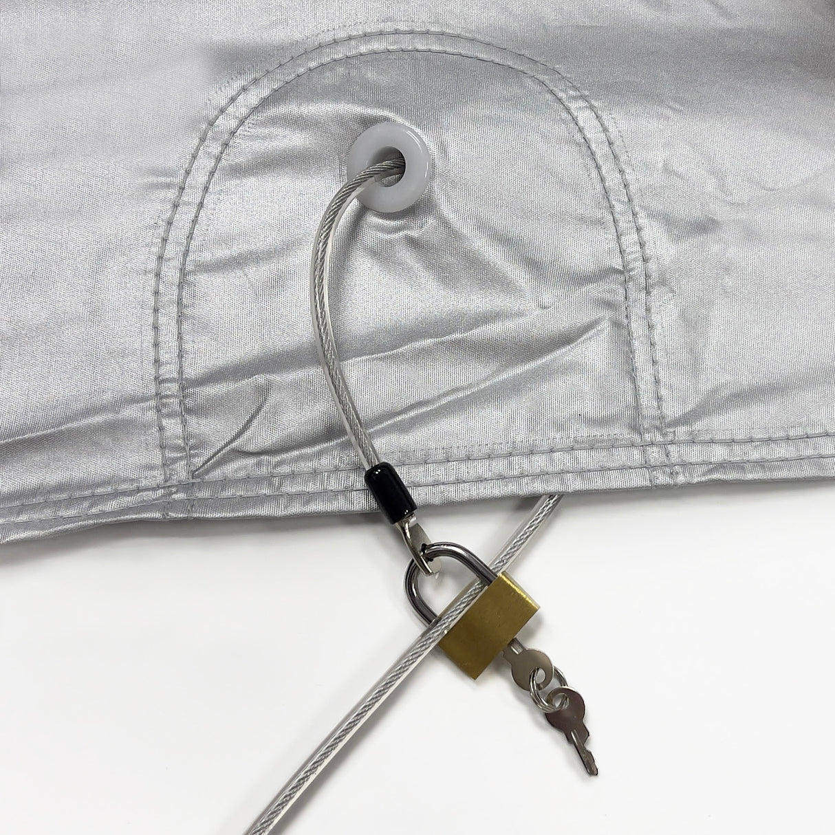 Strong braided steel cable lock fits through cover grommets to add protection and help secure the cover in heavy winds.