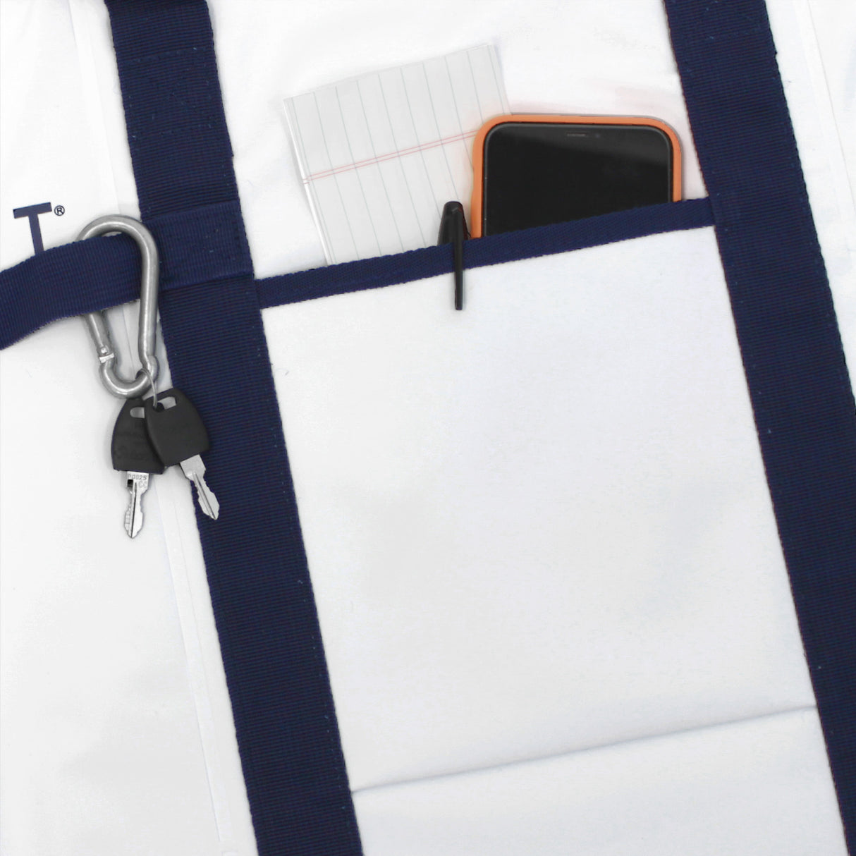 SavvyCraft marine soft cooler bag detail featuring a front gear pocket, heavy-duty blue webbing straps, and an accessory attachment loop for fishing tools