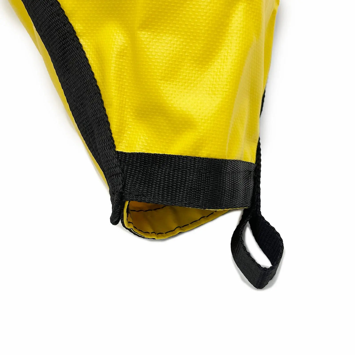 Close-up of yellow nylon drift sock sea anchor with reinforced black webbing and attachment loop for kayak and boat drift control