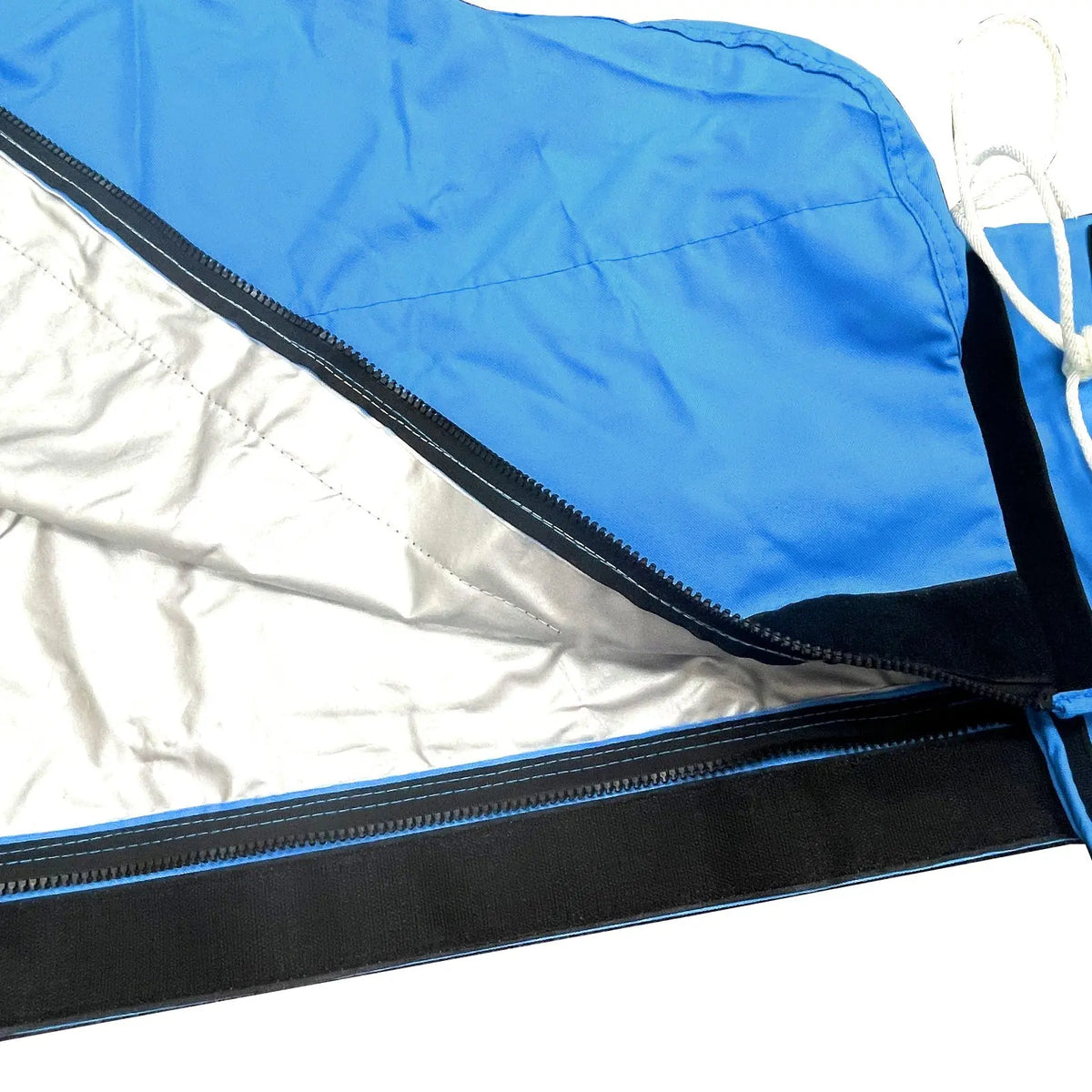 Heat-reflective interior lining with full-length zipper on blue waterproof mainsail boom cover