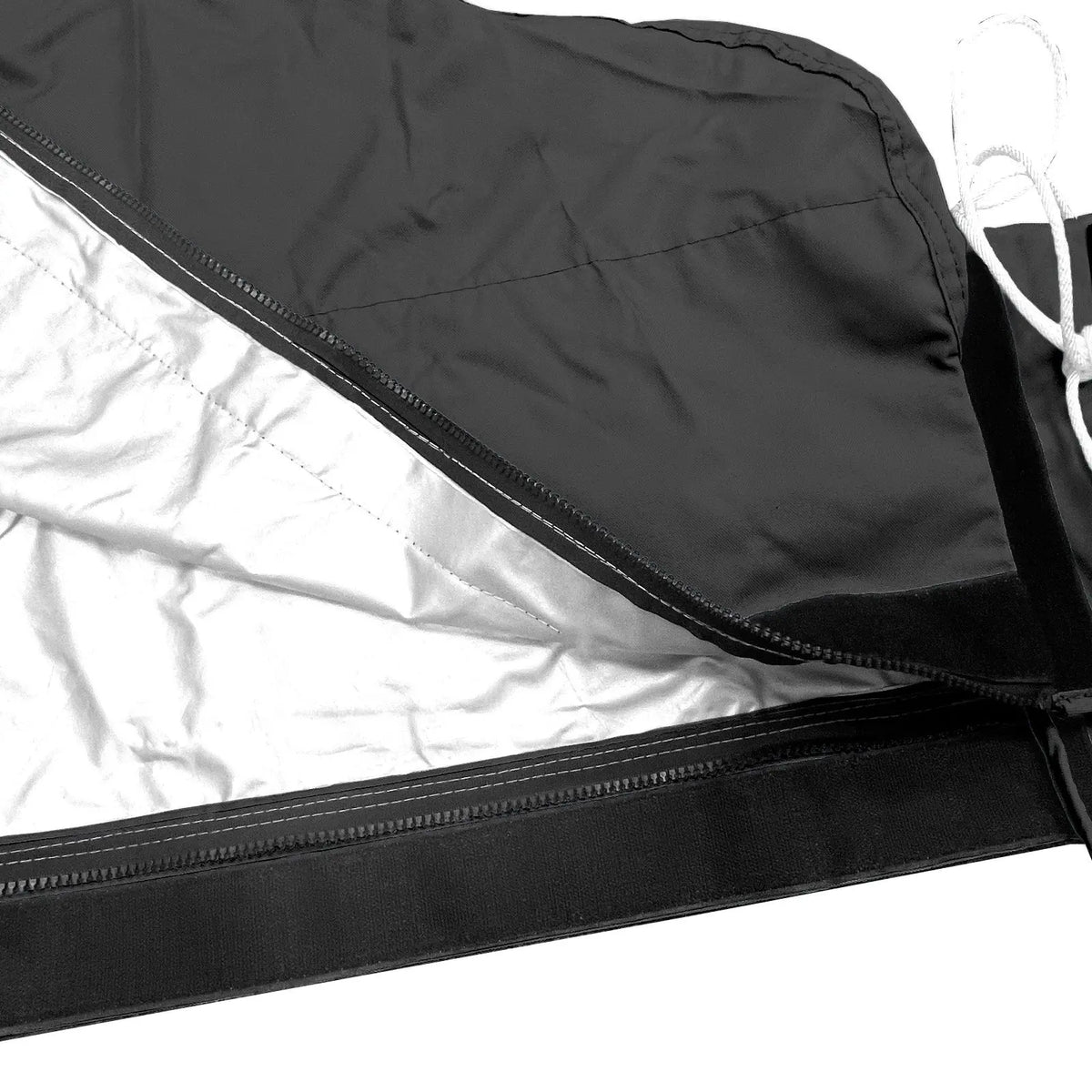 Heat-reflective interior lining with full-length zipper on black waterproof mainsail boom cover