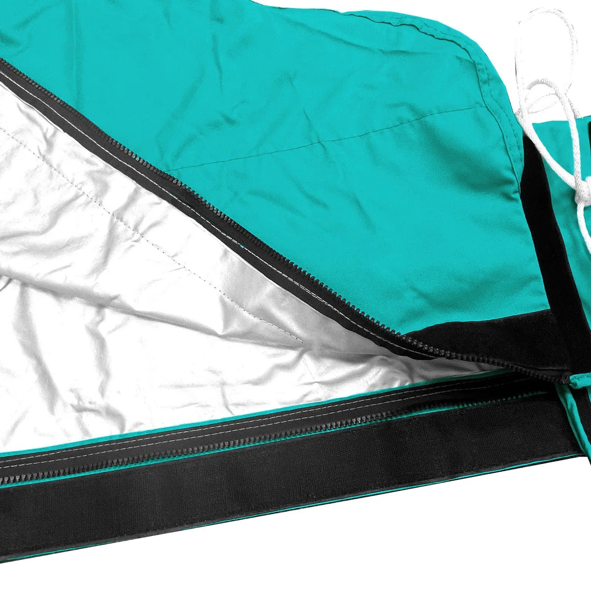 Heat-reflective interior lining with full-length zipper on teal waterproof mainsail boom cover
