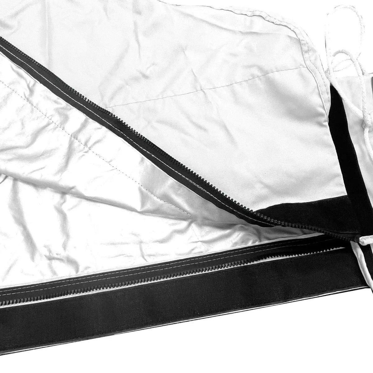 Heat-reflective interior lining with full-length zipper on white waterproof mainsail boom cover