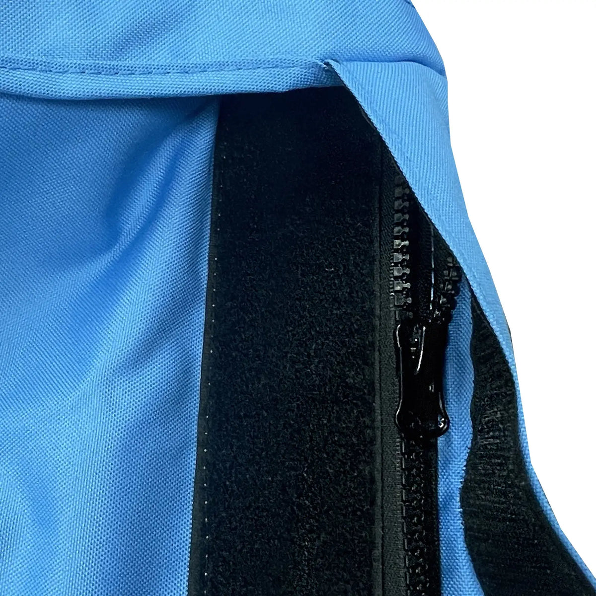 Velcro storm flap covering heavy-duty zipper on blue waterproof sailboat boom cover
