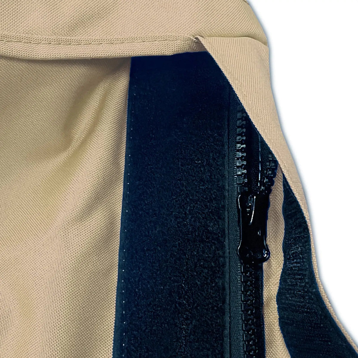 Velcro storm flap covering heavy-duty zipper on beige waterproof sailboat boom cover