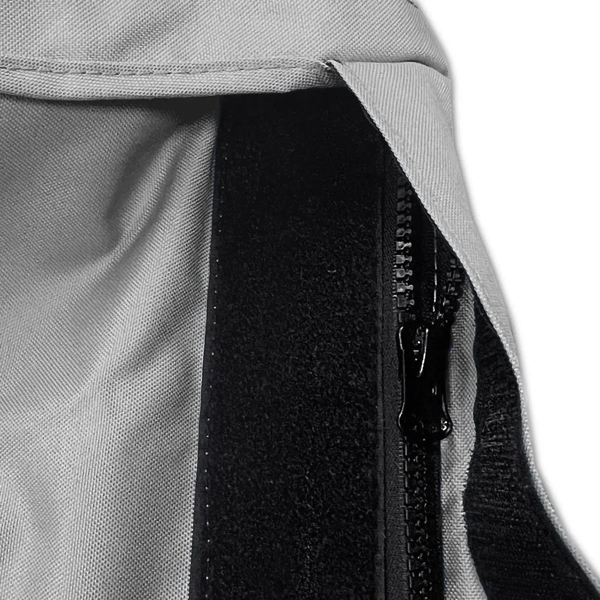 Velcro storm flap covering heavy-duty zipper on grey waterproof sailboat boom cover