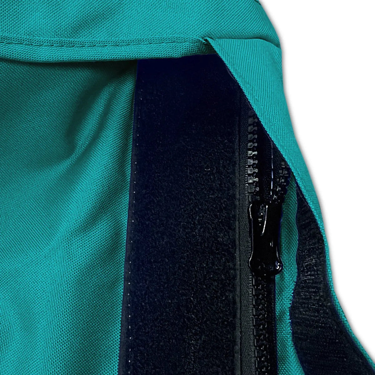 Velcro storm flap covering heavy-duty zipper on teal waterproof sailboat boom cover