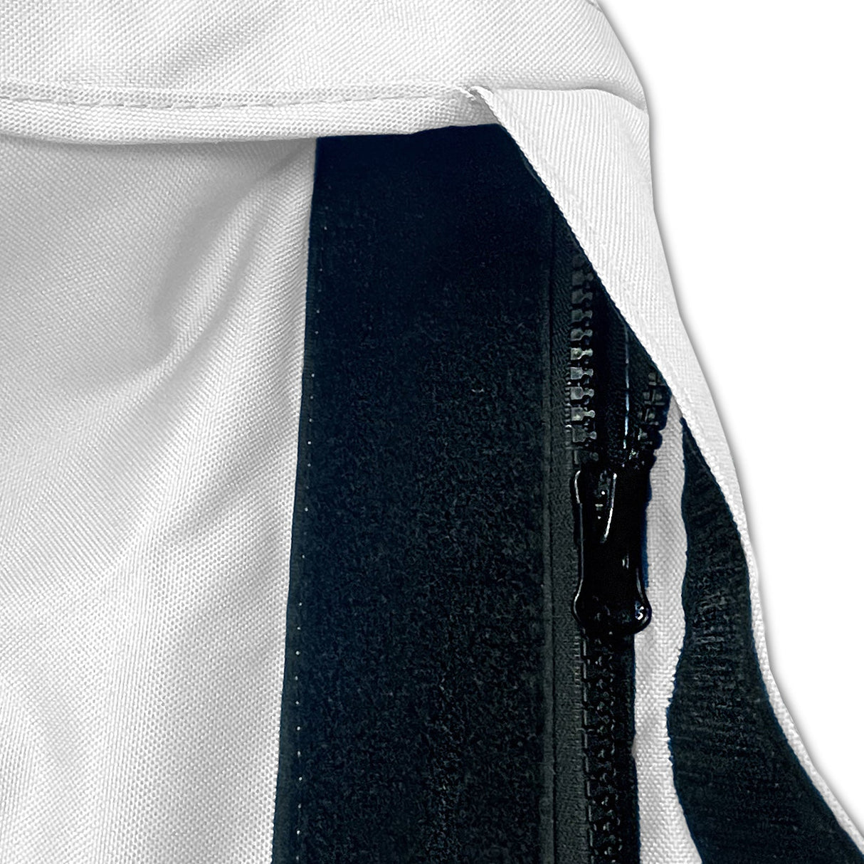 Velcro storm flap covering heavy-duty zipper on white waterproof sailboat boom cover