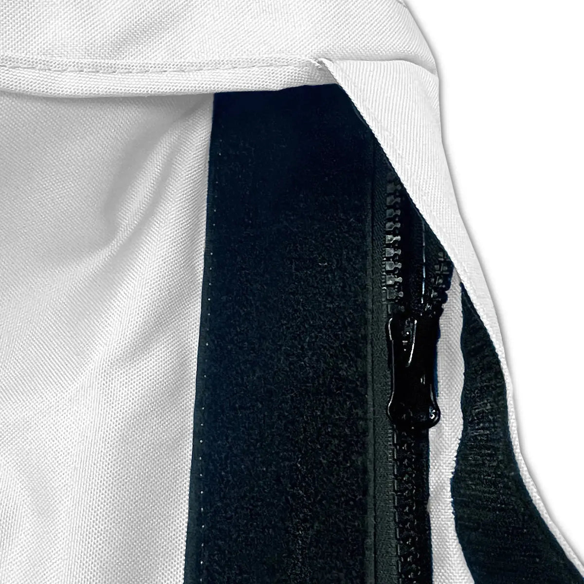 Velcro storm flap covering heavy-duty zipper on white waterproof sailboat boom cover