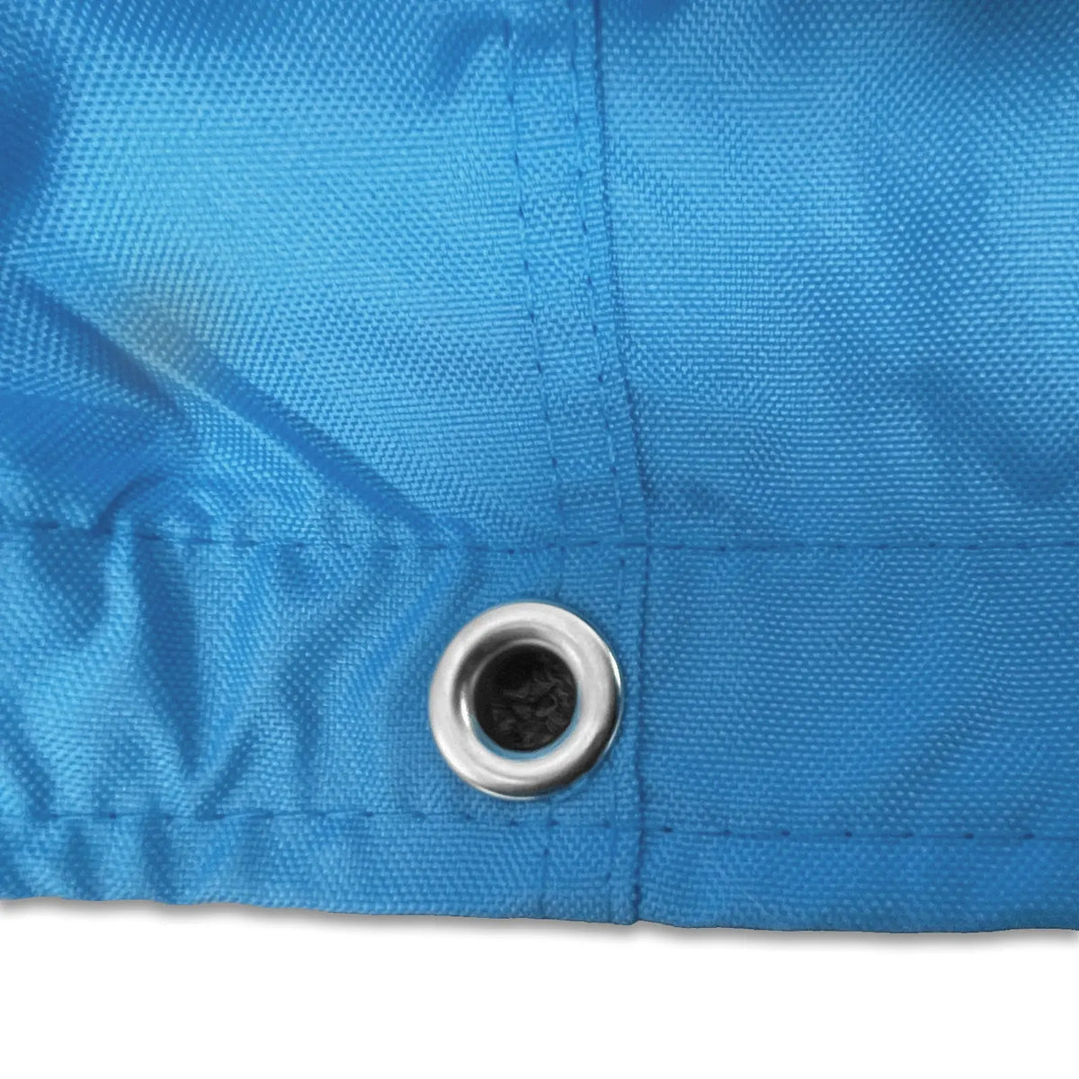 Stainless steel grommet on blue waterproof sailboat boom cover for drainage and ventilation