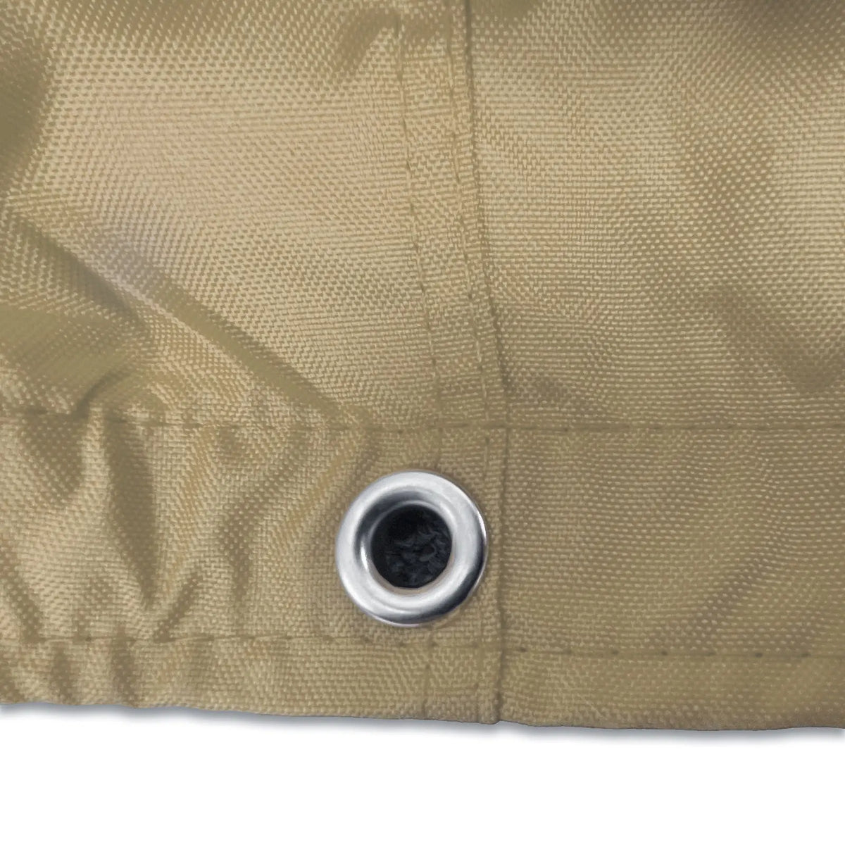 Stainless steel grommet on beige waterproof sailboat boom cover for drainage and ventilation
