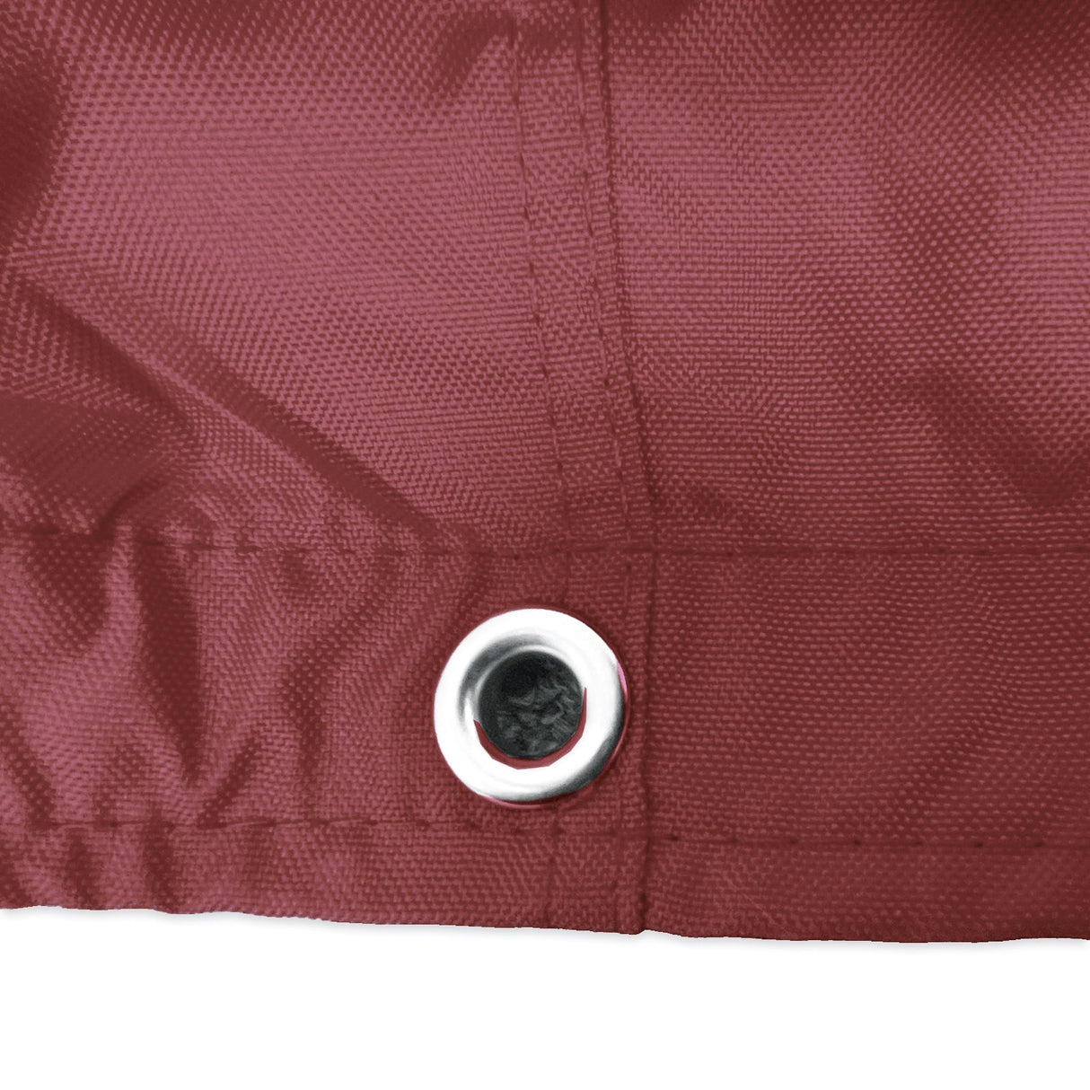 Stainless steel grommet on burgundy waterproof sailboat boom cover for drainage and ventilation