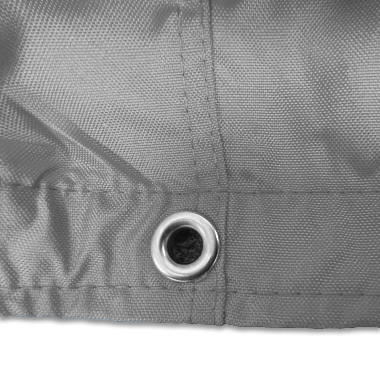 Stainless steel grommet on grey waterproof sailboat boom cover for drainage and ventilation