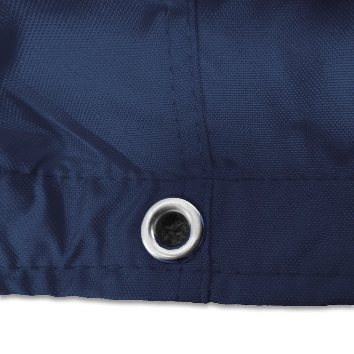 Stainless steel grommet on navy waterproof sailboat boom cover for drainage and ventilation