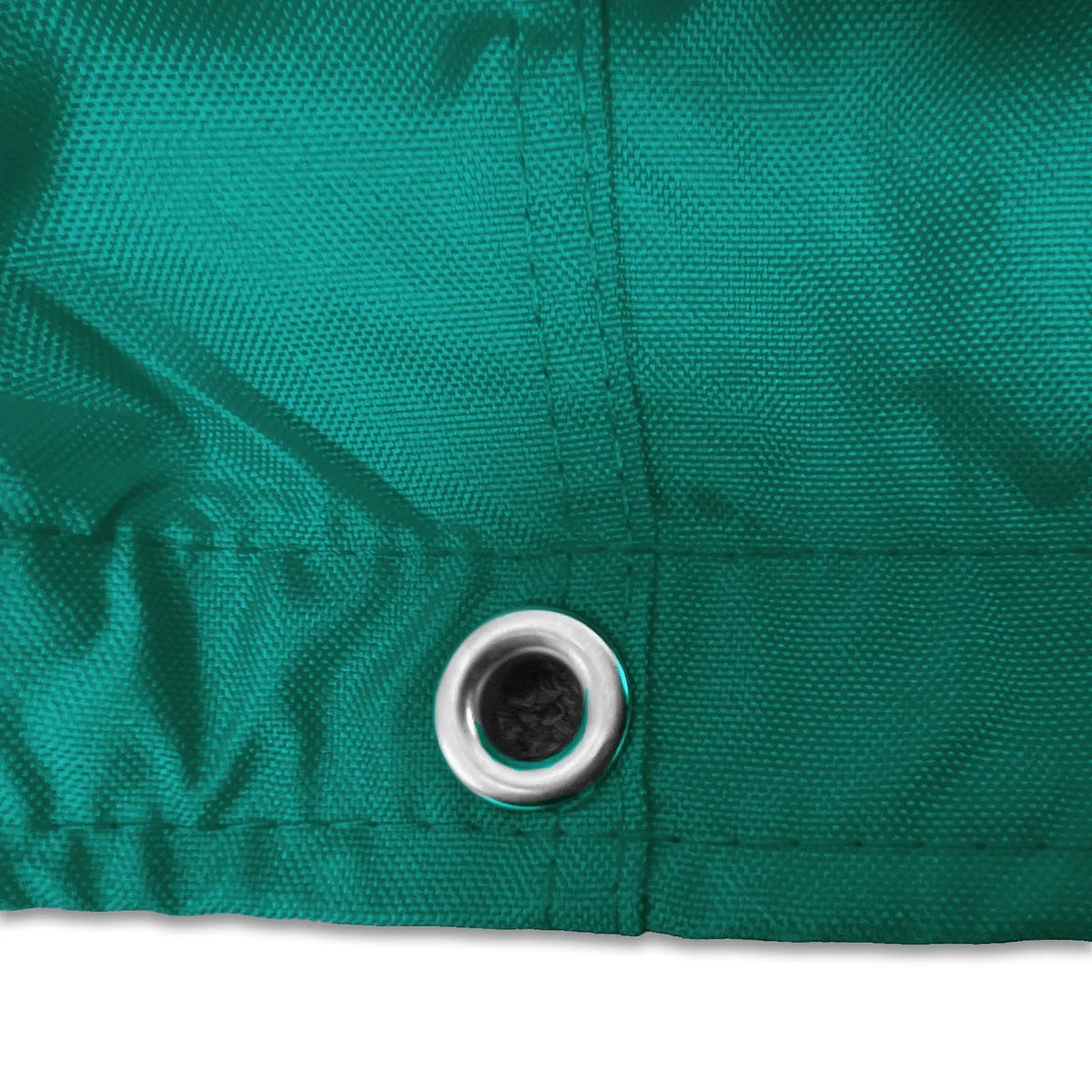Stainless steel grommet on teal waterproof sailboat boom cover for drainage and ventilation