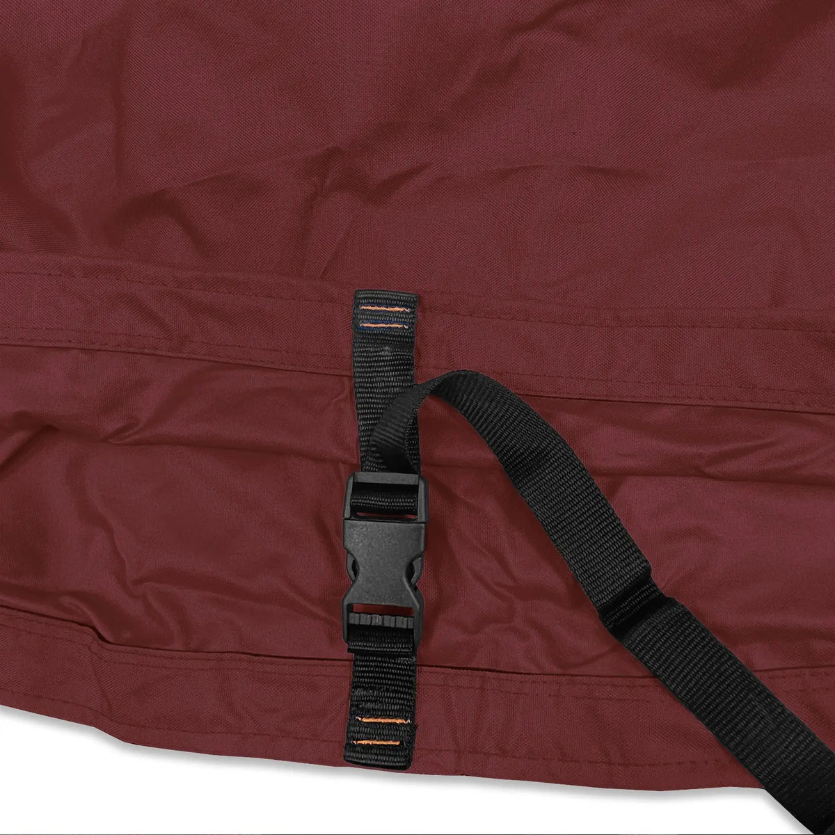 Adjustable buckle strap with reinforced stitching on burgundy waterproof sailboat boom cover
