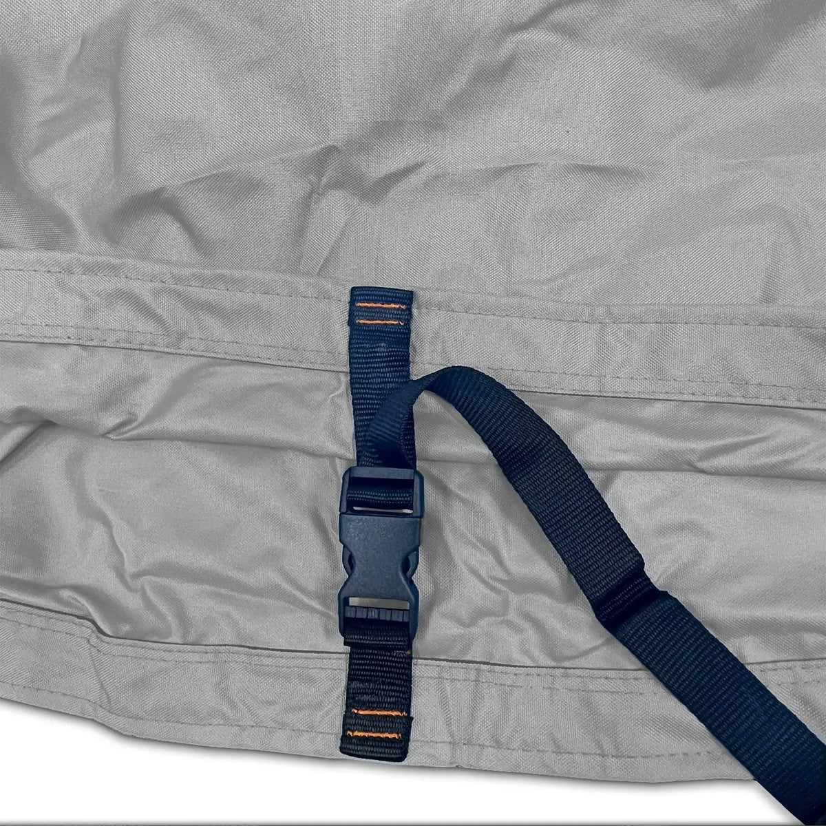 Adjustable buckle strap with reinforced stitching on grey waterproof sailboat boom cover