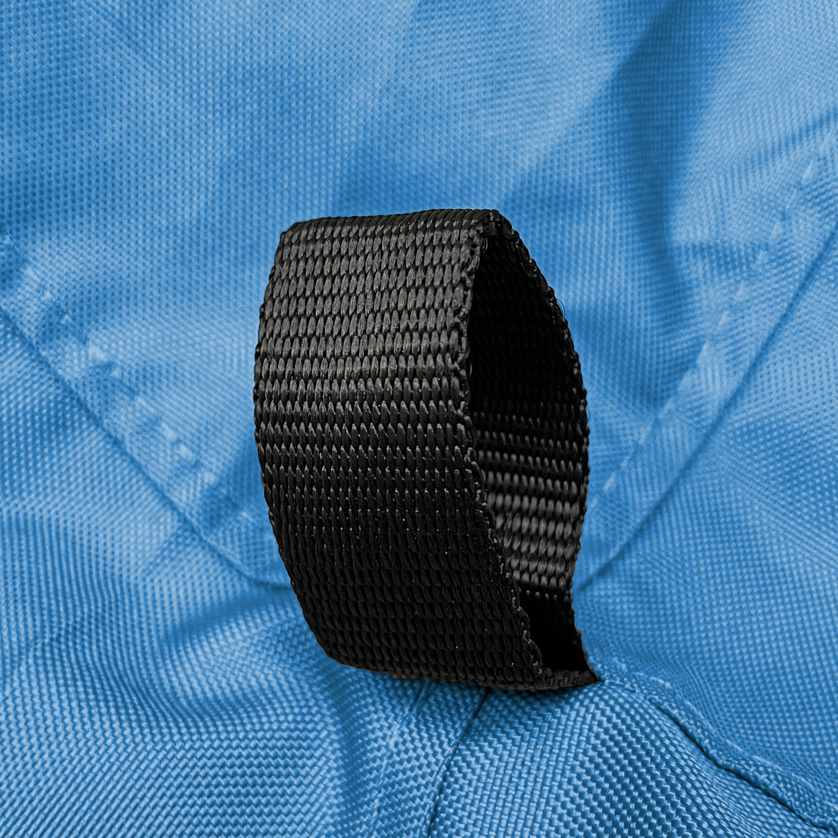 Reinforced black nylon loop securely stitched on durable blue polyester fabric, highlighting marine-grade construction and strong attachment point design on sailboat jib sail bag for secure gear handling and long-lasting outdoor performance