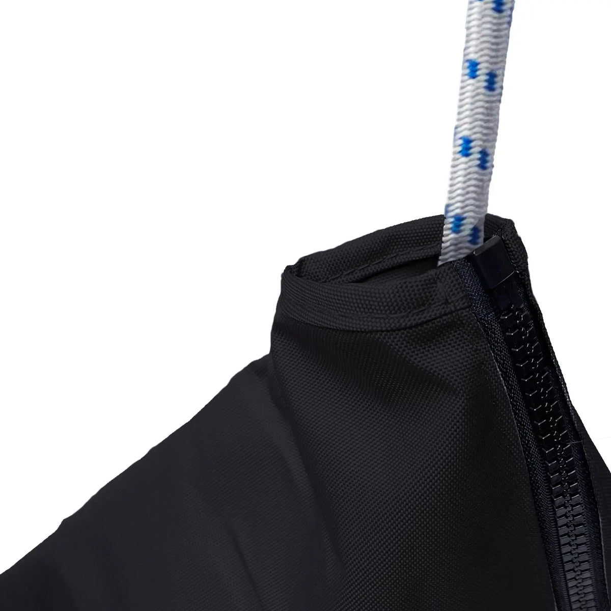 Close-up of waterproof marine-grade sailboat jib sail bag made from heavy-duty black polyester fabric with reinforced stitching, durable zipper closure, and white rope with blue tracers for secure sail storage and protection in harsh marine weather