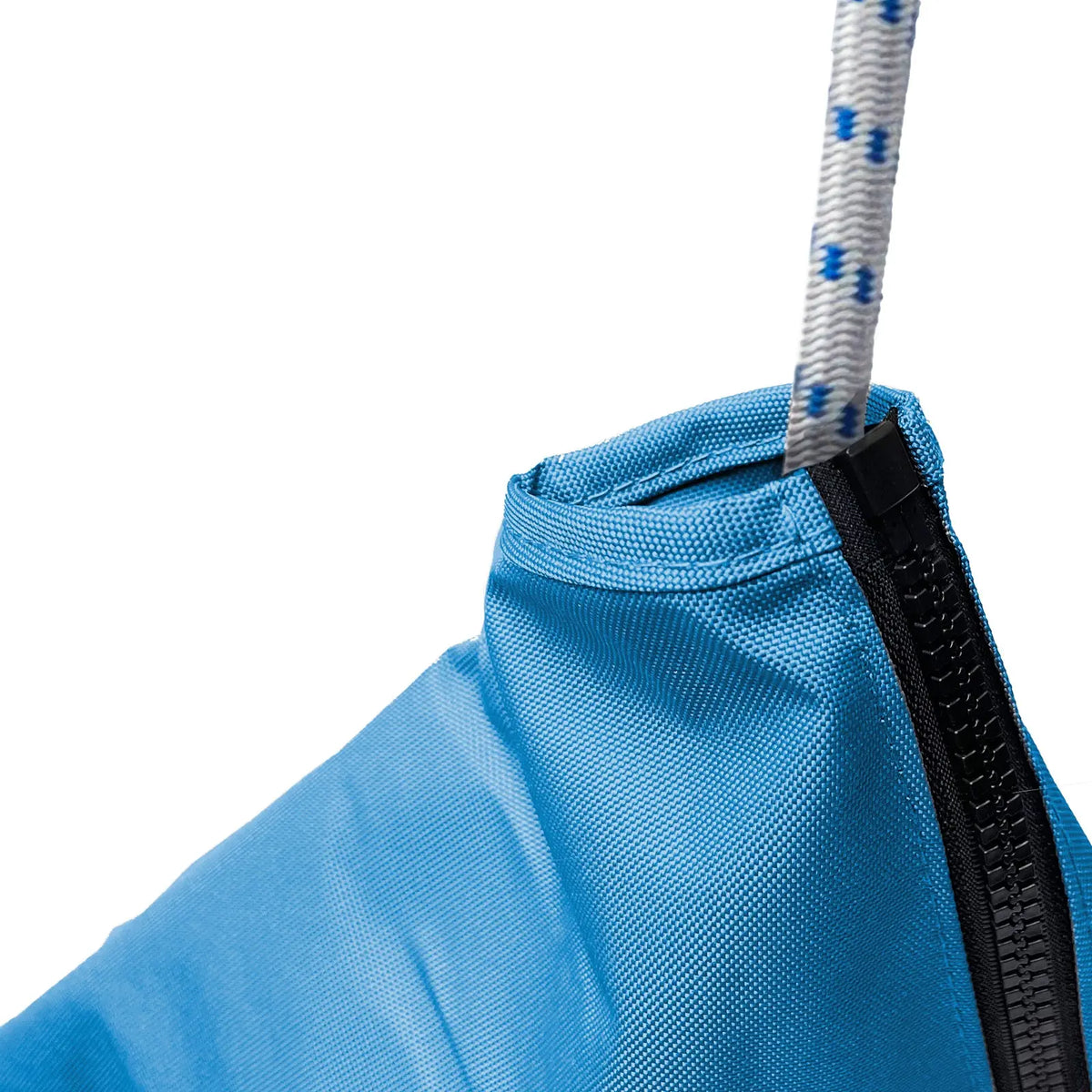 Close-up of waterproof marine-grade sailboat jib sail bag made from heavy-duty blue polyester fabric with reinforced stitching, durable zipper closure, and white rope with blue tracers for secure sail storage and protection in harsh marine weather