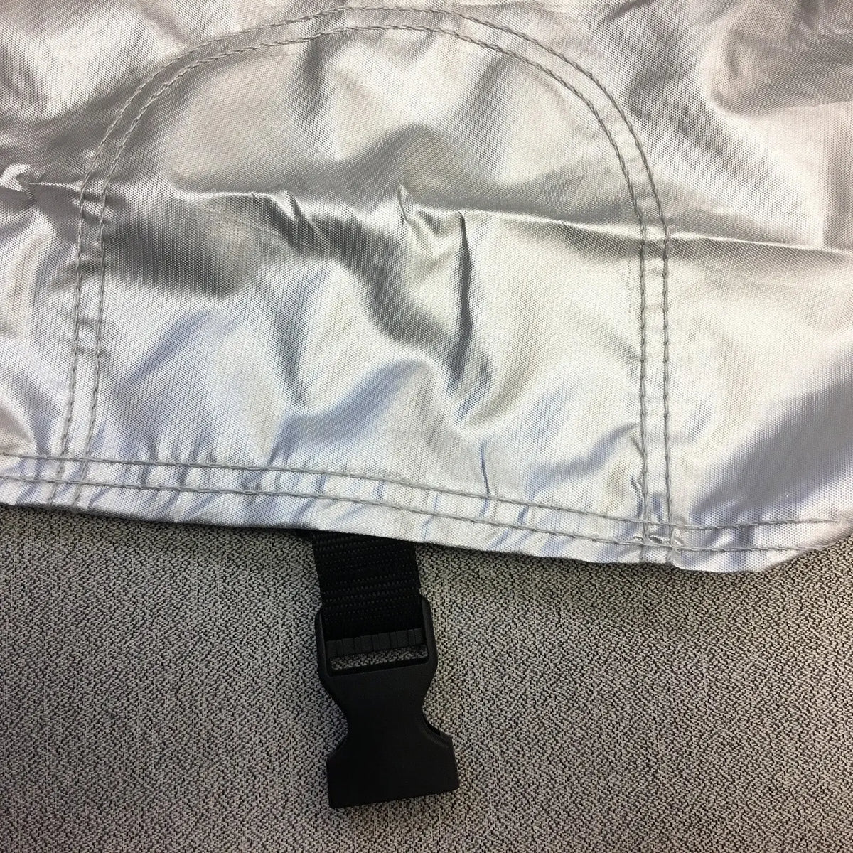 Sewn-in undercarriage straps with click-close buckles for maximum security and a snug, protective fit.