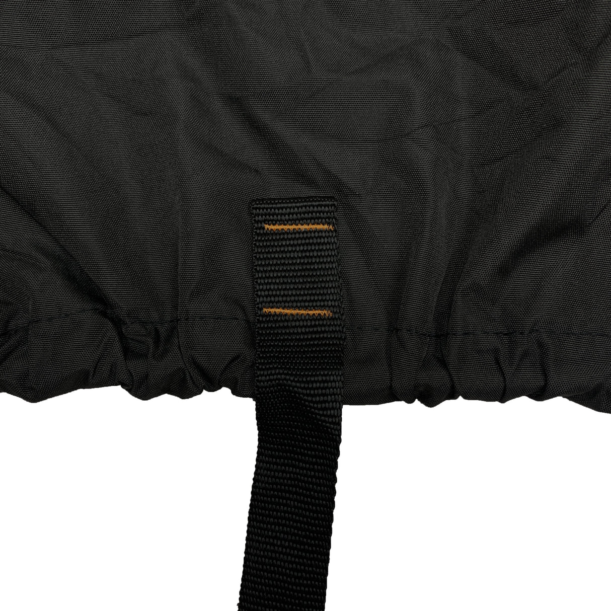 Close-up of strap and elastic hem on a black vehicle cover, designed to secure the cover tightly underneath the vehicle and prevent shifting, flapping, or wind lift during outdoor storage.