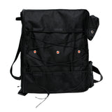 SavvyCraft black T-top boat life jacket storage bag, featuring a crisscross bungee cord system, ventilated mesh pockets, and side pouches for organizing marine gear