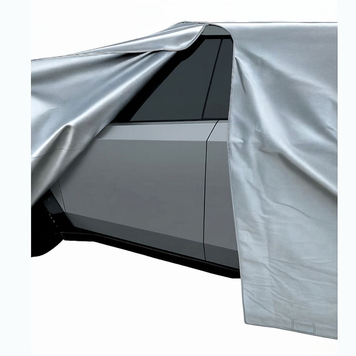 Tesla cybertruck partially covered with a silver car cover on a white background