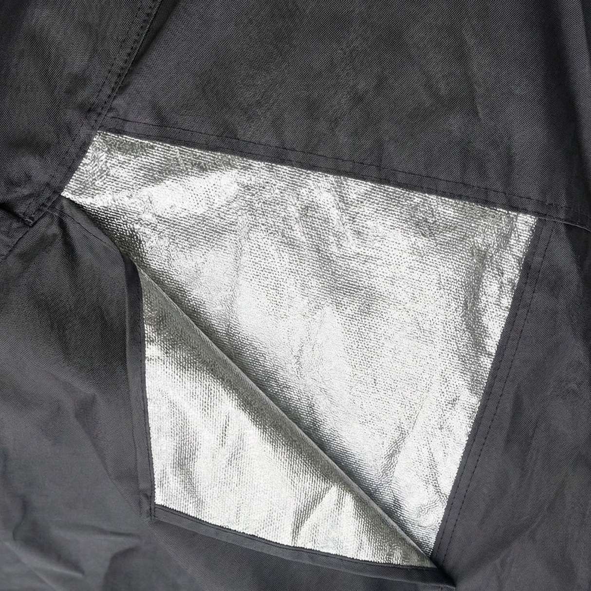 Detailed view of heavy duty, metallic heat shield fabric panels that guard against hot exhaust damage.