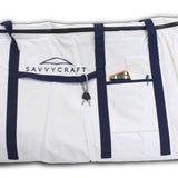 SavvyCraft marine soft cooler bag detail featuring a front gear pocket, heavy-duty blue webbing straps, and an accessory attachment loop for fishing tools