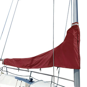 Burgundy waterproof sailboat mainsail boom cover installed on mast, protecting sail from sun and weather