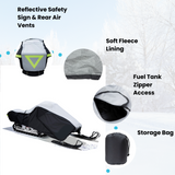 Durable snowmobile cover featuring reflective safety taping and rear air vents to reduce lofting, soft fleece lining, fuel tank zipper access, and a heavy-duty storage bag.