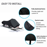 Easy to install black snowmobile cover with fully elasticized hems to provide a tight and custom fit, dual air vents to prevent condensation and reduce wind lofting, and built-in buckles and tie-down straps for quick and easy installation.
