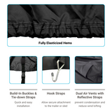 Detailed view of double-stitched, fully elasticized hems to provide secure fit, with built-in buckles and tie-down straps for easy installation, hook straps for secure attachment to the trailer and sled, and dual air vents with reflective straps to prevent condensation and reduce wind lofting. 