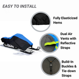 Easy to install, dual-toned, black and blue snowmobile cover with fully elasticized hems to provide a tight and custom fit, dual air vents to prevent condensation and reduce wind lofting, and built-in buckles and tie-down straps for quick and easy installation.